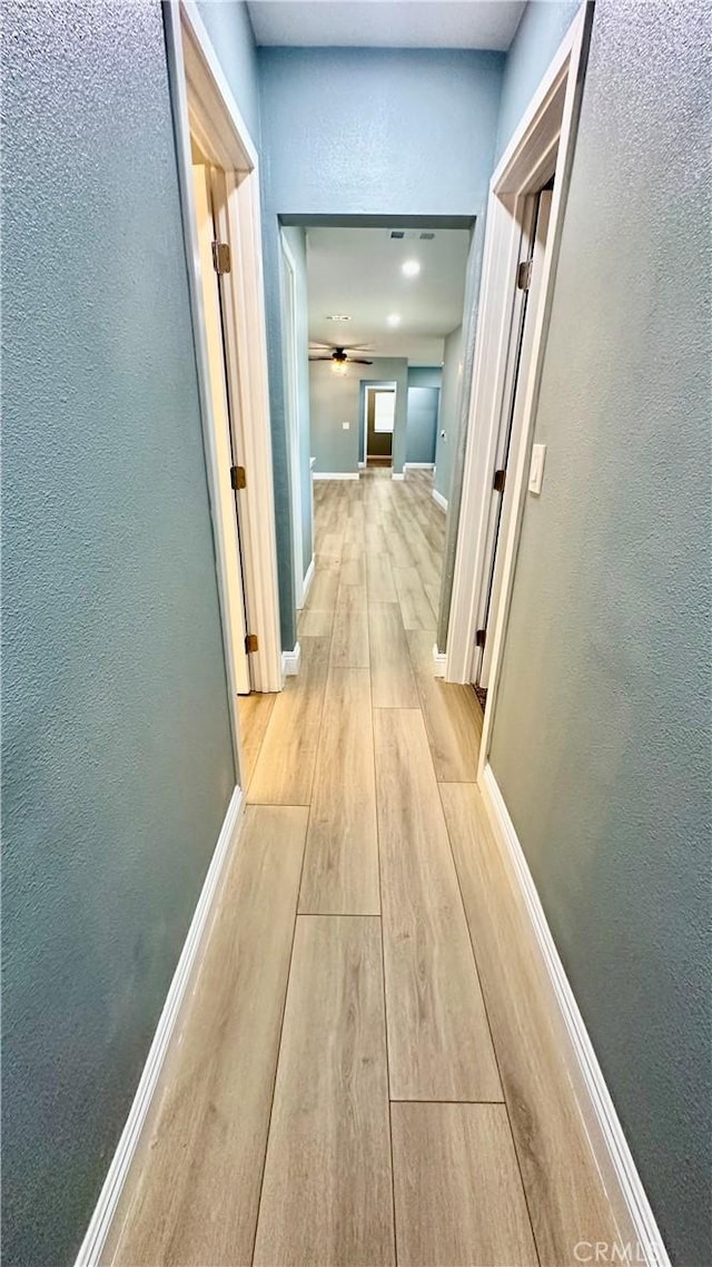 2045 S Cypress Ave, Ontario, CA 91762 - hall with light wood-style floors and a textured wall