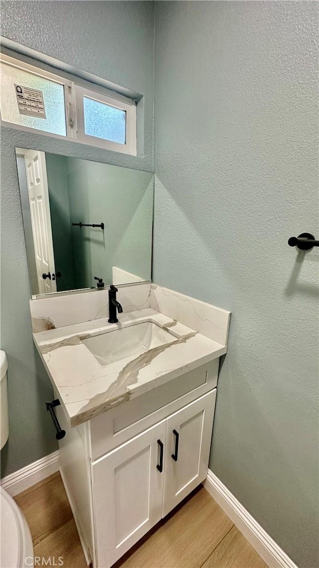 2045 S Cypress Ave, Ontario, CA 91762 - half bathroom featuring wood finished floors and vanity