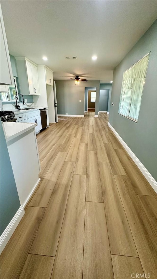 2045 S Cypress Ave, Ontario, CA 91762 - unfurnished living room with light wood-type flooring, a ceiling fan, and recessed lighting