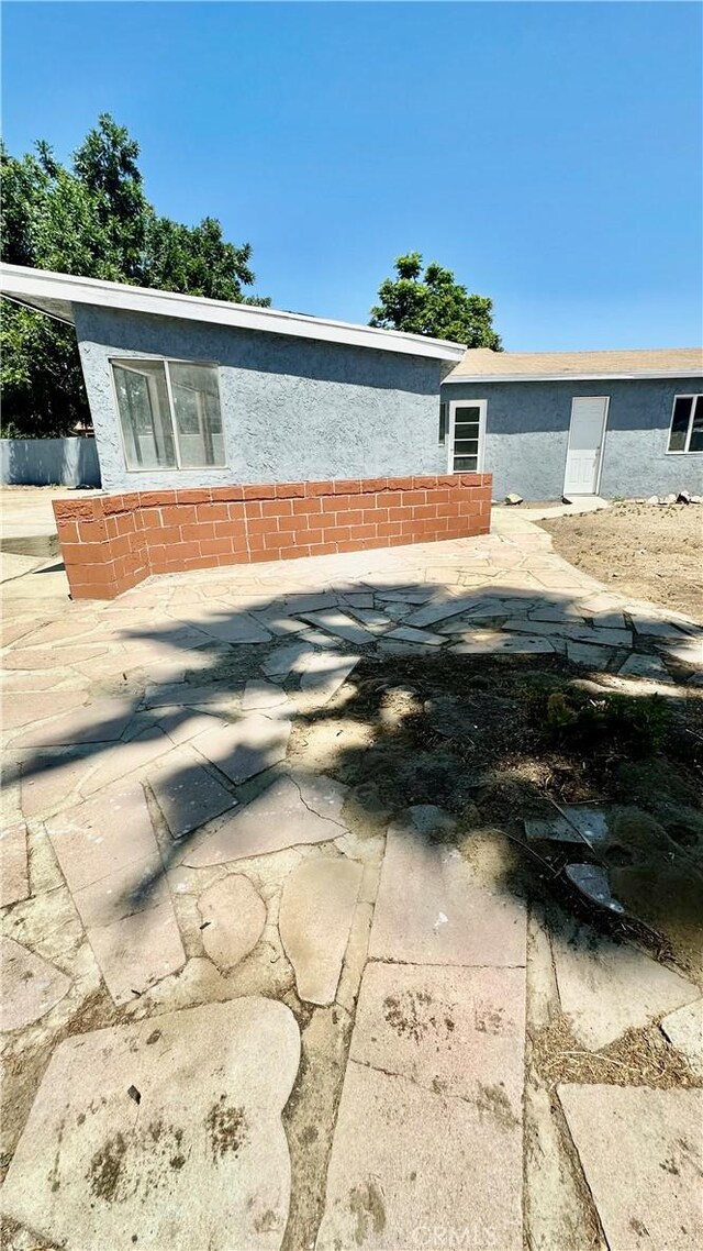 2045 S Cypress Ave, Ontario, CA 91762 - view of property exterior featuring stucco siding and a patio