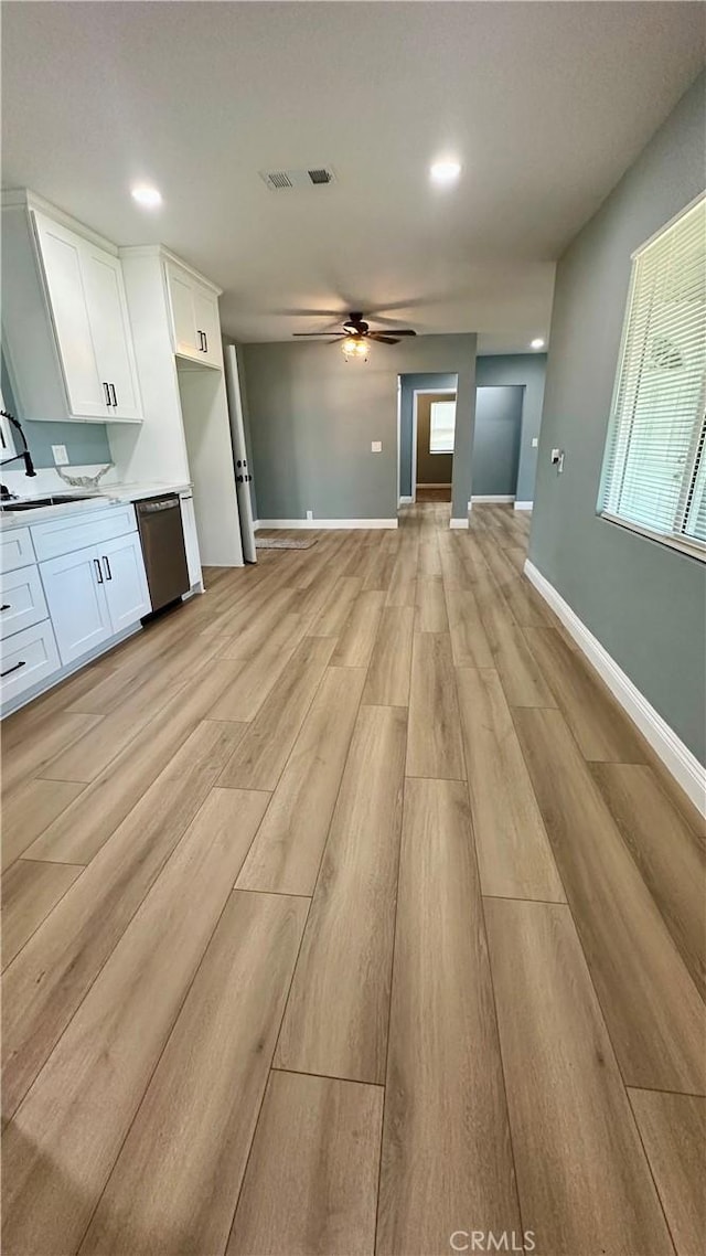 2045 S Cypress Ave, Ontario, CA 91762 - unfurnished living room featuring light wood finished floors, ceiling fan, healthy amount of natural light, and recessed lighting