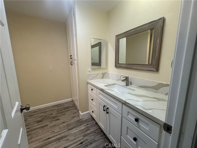 1881 Mitchell Ave Unit 34, Tustin, CA 92780 - bathroom with vanity, wood finished floors, and baseboards