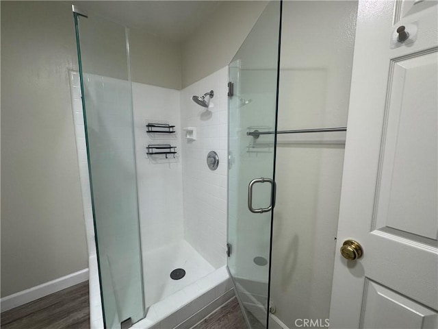 1881 Mitchell Ave Unit 34, Tustin, CA 92780 - bathroom with a stall shower, wood finished floors, and baseboards