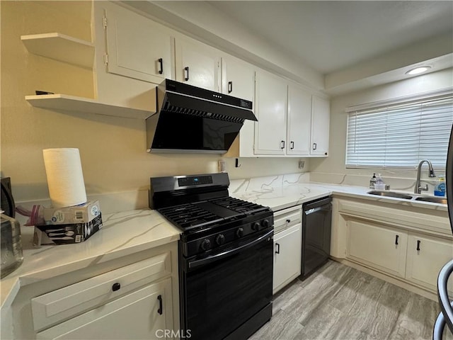 1881 Mitchell Ave Unit 34, Tustin, CA 92780 - kitchen with black appliances, extractor fan, a sink, white cabinets, and recessed lighting