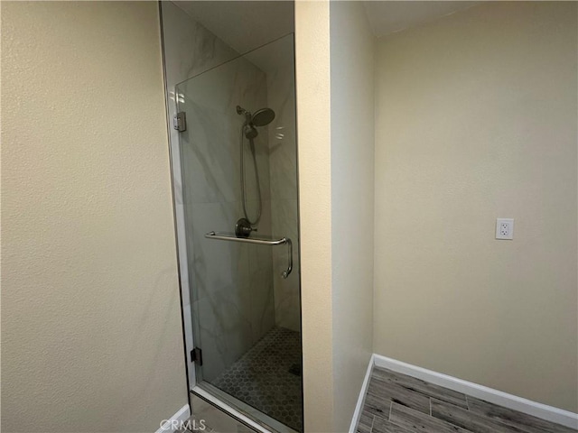 1881 Mitchell Ave Unit 34, Tustin, CA 92780 - full bath featuring a stall shower, wood finished floors, and baseboards