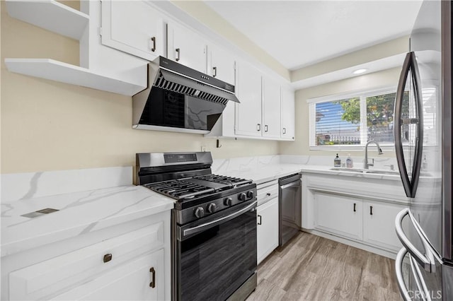 1881 Mitchell Ave Unit 34, Tustin, CA 92780 - kitchen featuring appliances with stainless steel finishes, exhaust hood, a sink, light wood finished floors, and white cabinetry
