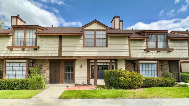 1133 S Paula Dr Unit 7, Fullerton, CA 92833 - multi unit property with a chimney, stone siding, and a front lawn
