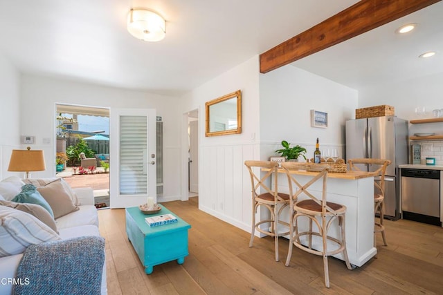 244 Cahuenga Dr, Oxnard, CA 93035 - living room with light wood-style flooring, wainscoting, beamed ceiling, bar area, and recessed lighting