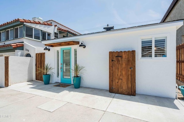 244 Cahuenga Dr, Oxnard, CA 93035 - view of exterior entry with stucco siding and a patio area