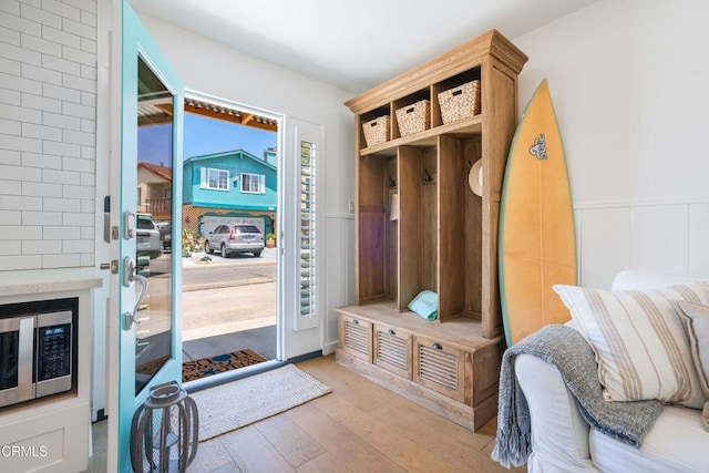 244 Cahuenga Dr, Oxnard, CA 93035 - mudroom featuring light wood-style flooring and wainscoting