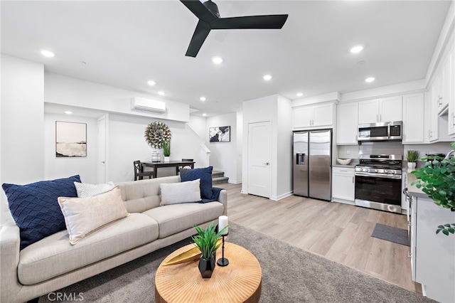 466 Besalu, Mission Viejo, CA 92692 - living area with stairway, a wall mounted AC, light wood-type flooring, recessed lighting, and ceiling fan