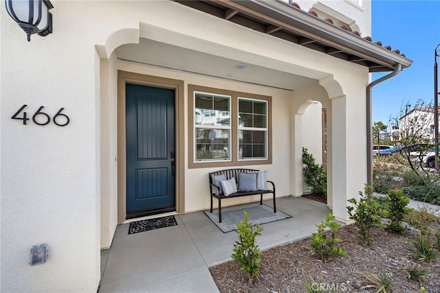 466 Besalu, Mission Viejo, CA 92692 - view of exterior entry featuring stucco siding and a porch