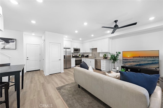 466 Besalu, Mission Viejo, CA 92692 - living area with light wood-style flooring, ceiling fan, and recessed lighting