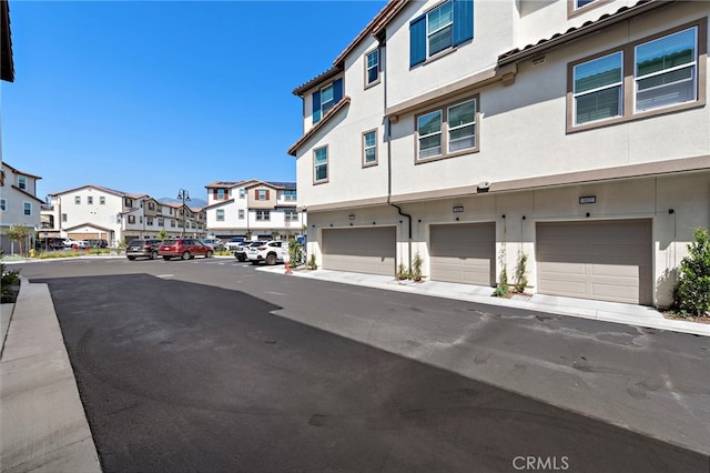 466 Besalu, Mission Viejo, CA 92692 - view of asphalt street featuring a residential view and sidewalks