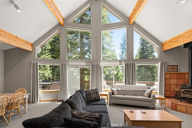 120 Top Of The W Dr, Chester, CA 96020 - living room with a wood stove, high vaulted ceiling, carpet flooring, and beamed ceiling
