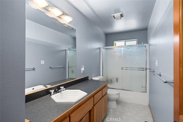 120 Top Of The W Dr, Chester, CA 96020 - full bathroom featuring toilet, vanity, and bath / shower combo with glass door