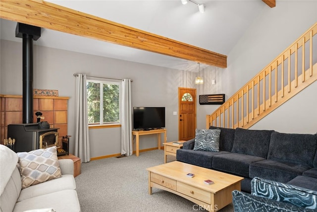 120 Top Of The W Dr, Chester, CA 96020 - living room with a wood stove, carpet flooring, beam ceiling, baseboards, and stairs