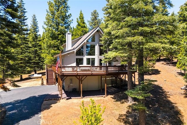 120 Top Of The W Dr, Chester, CA 96020 - rustic home with stairs, a deck, and a chimney