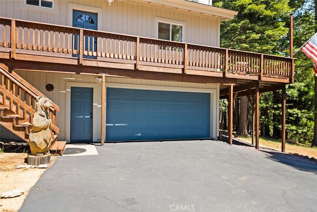 120 Top Of The W Dr, Chester, CA 96020 - view of front facade with asphalt driveway, an attached garage, a deck, and stairway