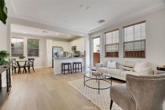 908 N Alameda Ave, Azusa, CA 91702 - living area featuring light wood-type flooring, baseboards, and recessed lighting