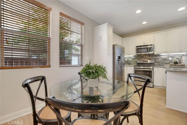 908 N Alameda Ave, Azusa, CA 91702 - dining area featuring recessed lighting, light wood finished floors, and baseboards