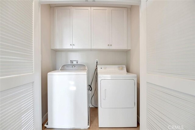 908 N Alameda Ave, Azusa, CA 91702 - washroom with washer and dryer and cabinet space