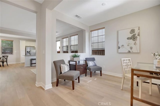 908 N Alameda Ave, Azusa, CA 91702 - living area with light wood-type flooring, healthy amount of natural light, and baseboards