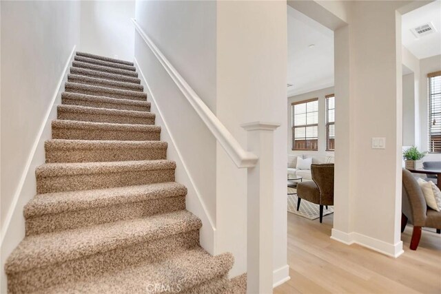 908 N Alameda Ave, Azusa, CA 91702 - staircase with wood finished floors and baseboards