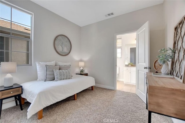 908 N Alameda Ave, Azusa, CA 91702 - bedroom featuring light carpet, ensuite bath, and baseboards