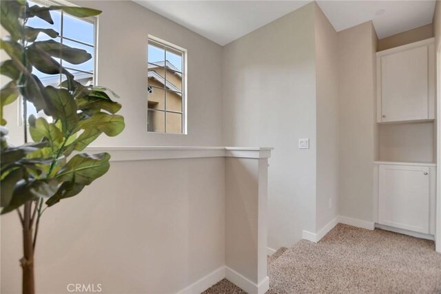 908 N Alameda Ave, Azusa, CA 91702 - corridor with carpet flooring and baseboards