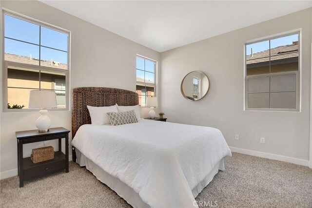 908 N Alameda Ave, Azusa, CA 91702 - bedroom featuring baseboards and light colored carpet