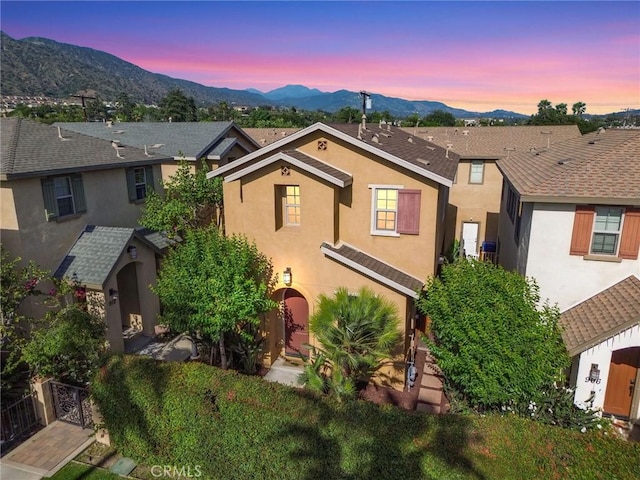 908 N Alameda Ave, Azusa, CA 91702 - view of front of home with stucco siding and a mountain view