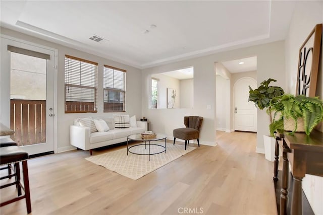 908 N Alameda Ave, Azusa, CA 91702 - living room with light wood-style flooring, a raised ceiling, baseboards, and recessed lighting