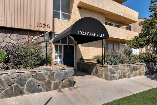 1020 Granville Ave Unit 205, Los Angeles, CA 90049 - view of exterior entry with stucco siding