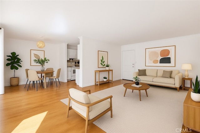1020 Granville Ave Unit 205, Los Angeles, CA 90049 - living room with light wood-style flooring and crown molding