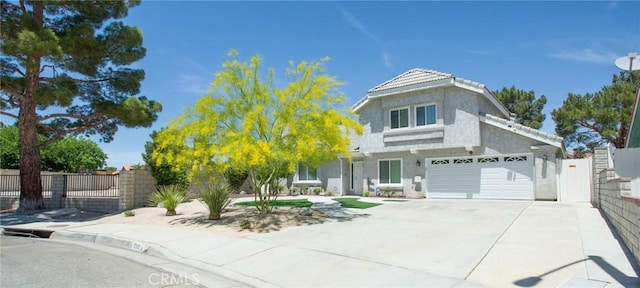 5515 Katrina Pl, Palmdale, CA 93552 - view of front of house with driveway, stucco siding, and a garage