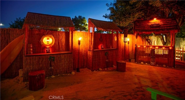 5515 Katrina Pl, Palmdale, CA 93552 - patio at night featuring a fenced backyard