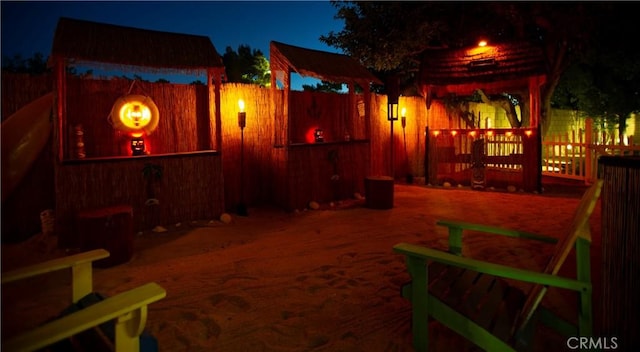 5515 Katrina Pl, Palmdale, CA 93552 - yard at night featuring a fenced backyard