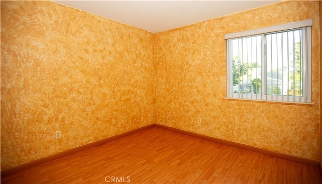 5515 Katrina Pl, Palmdale, CA 93552 - unfurnished room with baseboards and wood finished floors