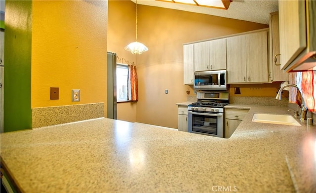 5515 Katrina Pl, Palmdale, CA 93552 - kitchen with appliances with stainless steel finishes, light countertops, high vaulted ceiling, decorative light fixtures, and a textured wall