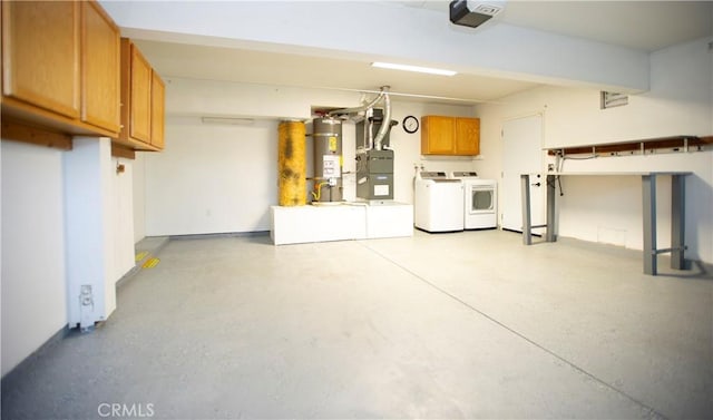 5515 Katrina Pl, Palmdale, CA 93552 - garage featuring washer and dryer, secured water heater, and a garage door opener