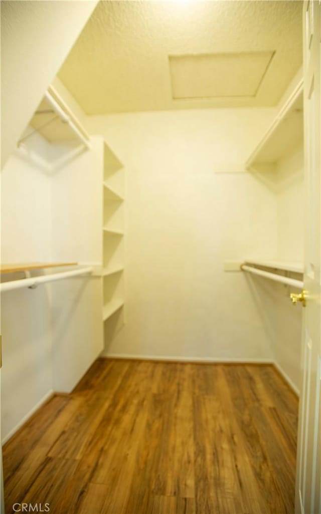 5515 Katrina Pl, Palmdale, CA 93552 - spacious closet with attic access and wood finished floors