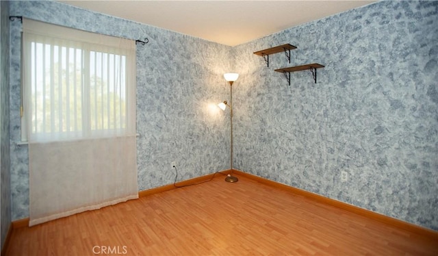 5515 Katrina Pl, Palmdale, CA 93552 - unfurnished room with wood finished floors and wallpapered walls