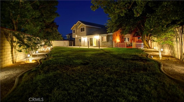 5515 Katrina Pl, Palmdale, CA 93552 - back of house at twilight with a fenced backyard