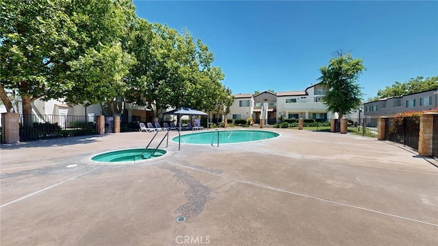 24420 Flaxwood Ln Unit 204, Newhall, CA 91321 - community pool with a gazebo, a residential view, a community hot tub, and a patio area