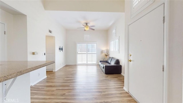 24420 Flaxwood Ln Unit 204, Newhall, CA 91321 - entryway featuring ceiling fan, light wood-style flooring, and baseboards