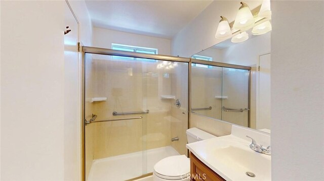 24420 Flaxwood Ln Unit 204, Newhall, CA 91321 - bathroom with vanity, a stall shower, and toilet