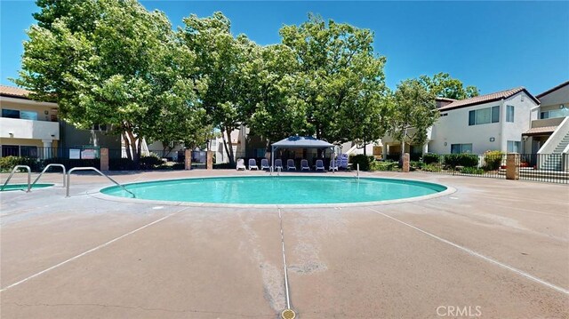 24420 Flaxwood Ln Unit 204, Newhall, CA 91321 - community pool with a residential view and a patio