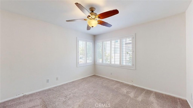 24420 Flaxwood Ln Unit 204, Newhall, CA 91321 - spare room with light carpet, a ceiling fan, and baseboards
