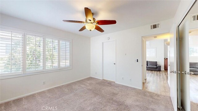 24420 Flaxwood Ln Unit 204, Newhall, CA 91321 - unfurnished bedroom featuring light colored carpet, baseboards, and ceiling fan